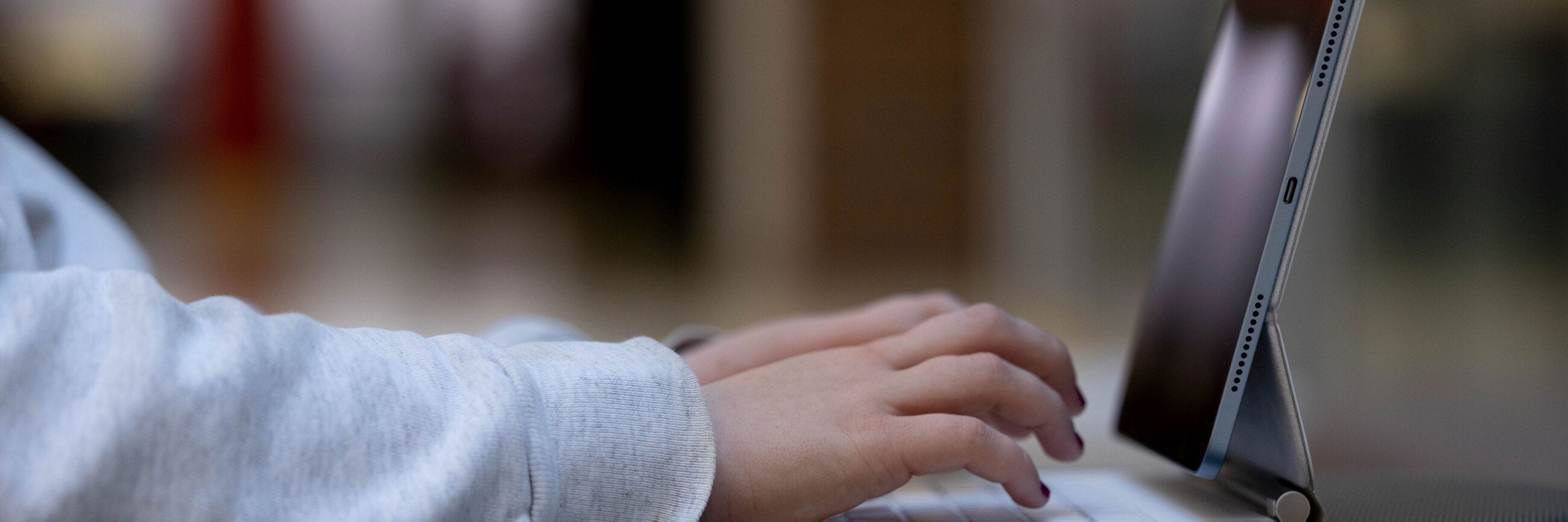 Female student working on her laptop. 